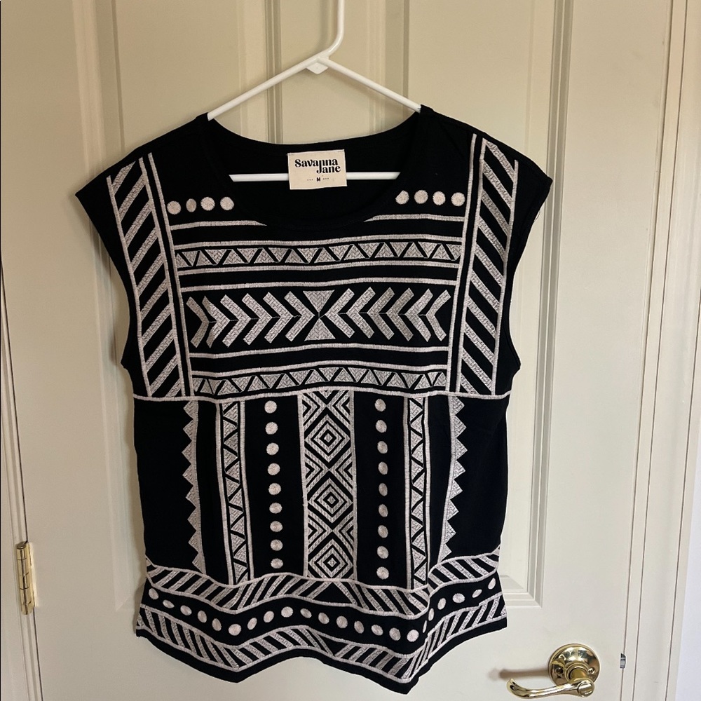 Womens black and white embroidery on the front. Size Medium.